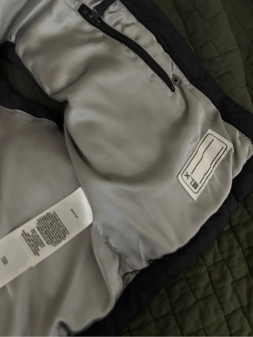 Columbia Kids Black Hooded Vest with Silver Lining and fleur-de-lis.